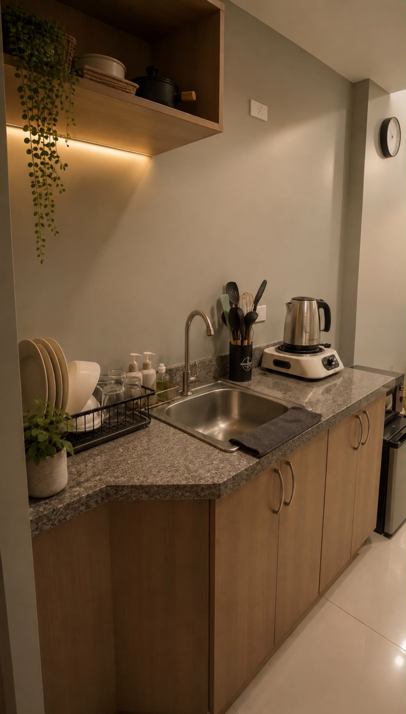 Kitchen counter with sink, kettle and induction hob